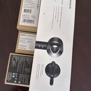 Dyson supersonic hairdryer. Black and nickel colored. Brand new unopened.